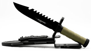 Humvee Survival Gear Next Gen fixed blade sawback survival knife with OD green rubber handle and sheath.
